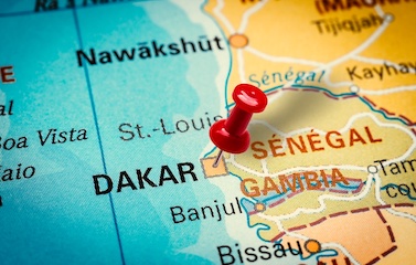a picture of a red pin pinned on the capital of Senegal Dakar