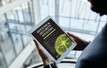 a picture of a person holding a tablet with the graphic of the new published book