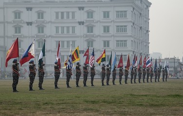 a picture of soldiers holding various country flags
