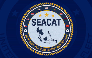 a picture of SEACAT logo with yellow rope as the outer circle including various Southeast Asian countries flag